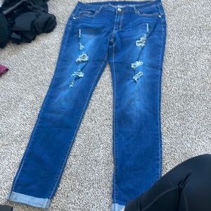 Light/bark blue jeans with holes  never warn